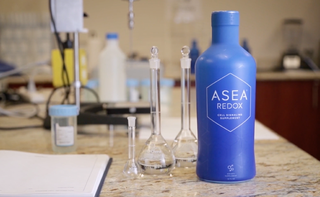 Buy Redox Cell Signaling Supplement - Healing Tao Australia. Blue bottle of Asea redox and chemistry set on a marble tabletop
